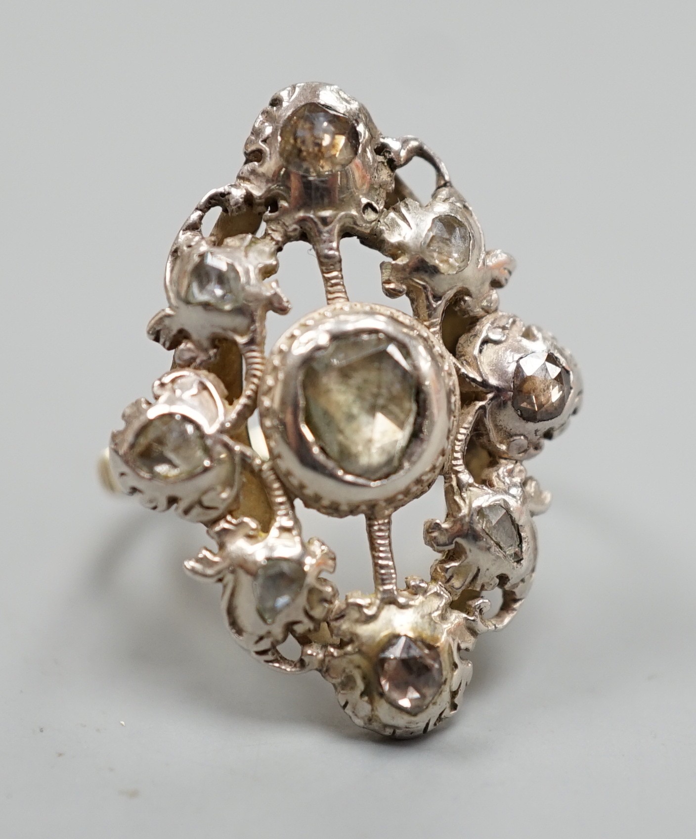 A pierced yellow and white metal, rose cut diamond cluster set ring (adapted?), size K, gross weight 6.1 grams.